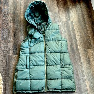 Womens long puffer vest with hood.